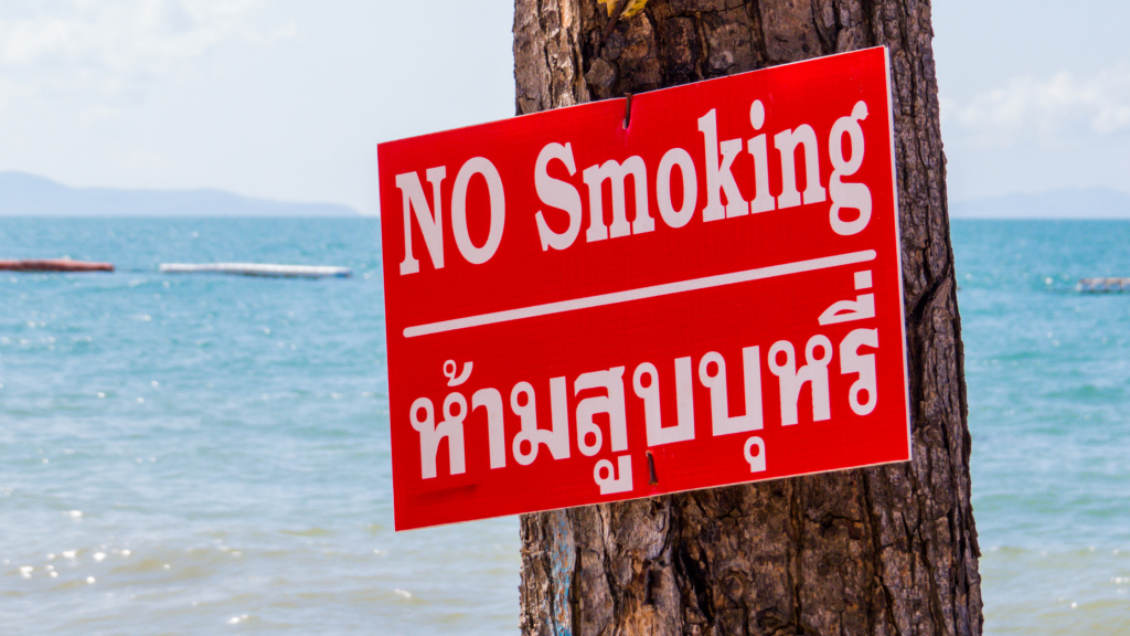 No smoking sign posted on a tree in Thailand.